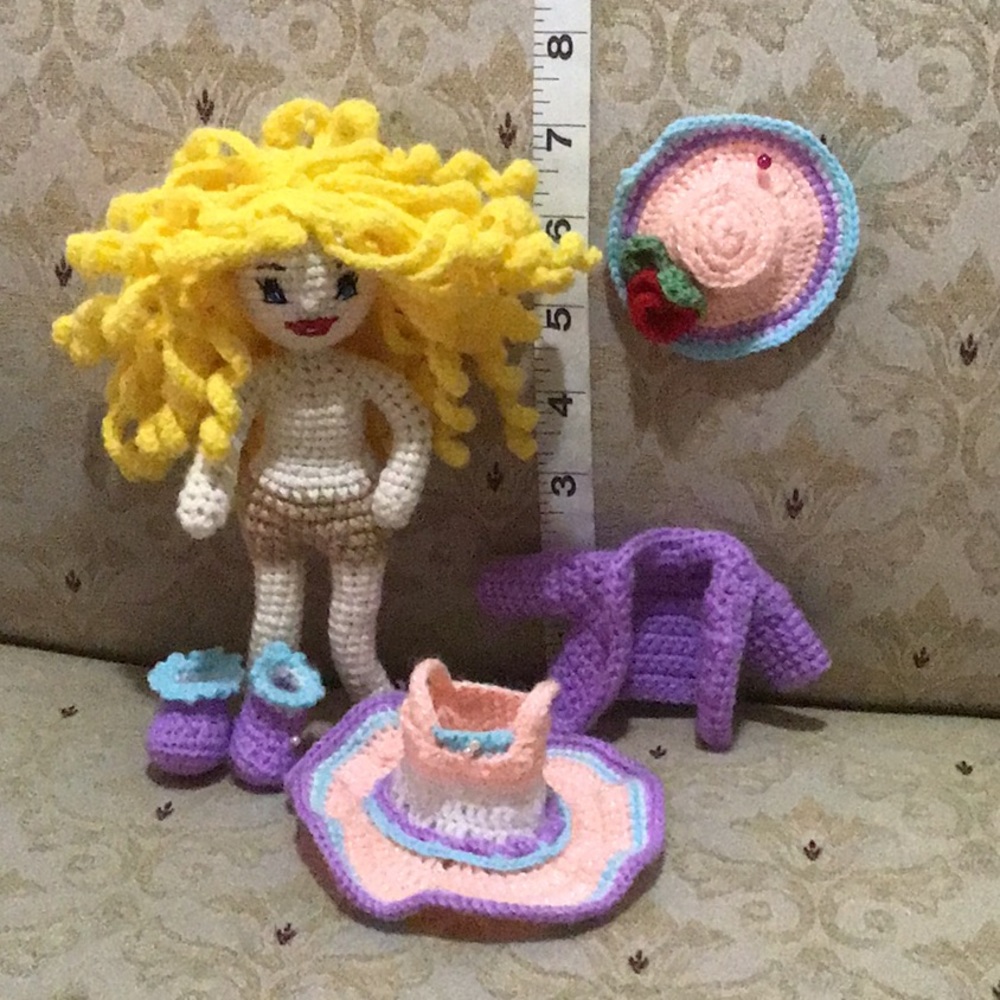 Handmade crochet doll and accessories.